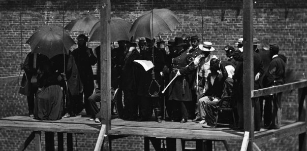 Close-up: the death warrant for the four is being read aloud by General John F. Hartranft.